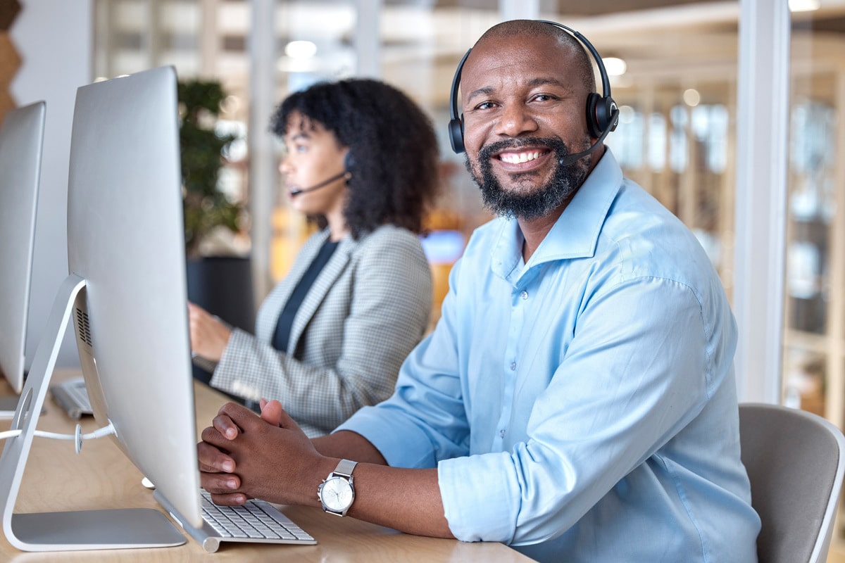 call-center-portrait-of-black-man-and-smile-at-co-2023-11-27-04-58-49-utc-min