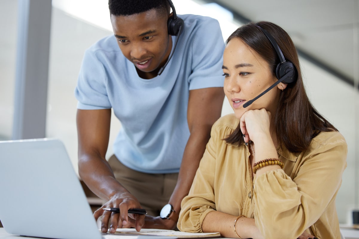 shot-of-two-businesspeople-working-together-on-a-l-2023-11-27-05-21-59-utc-min