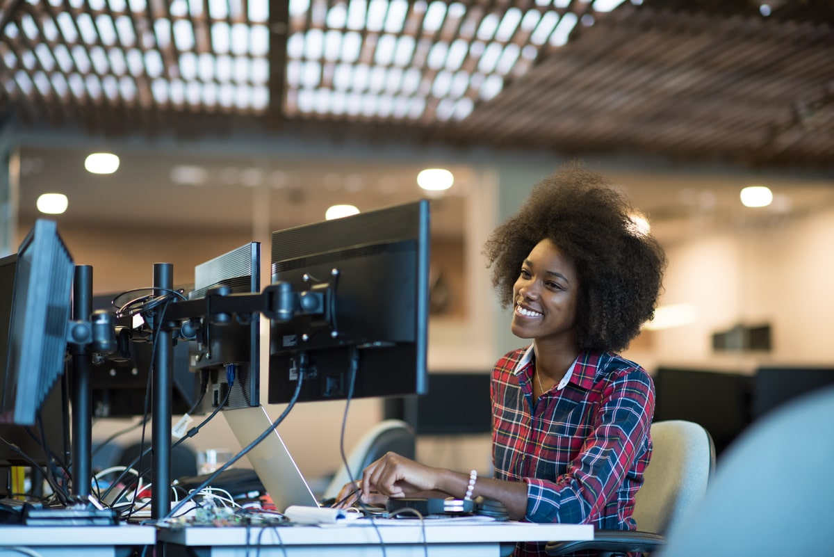 young-black-woman-at-her-workplace-in-modern-offic-2023-11-27-04-55-24-utc-min